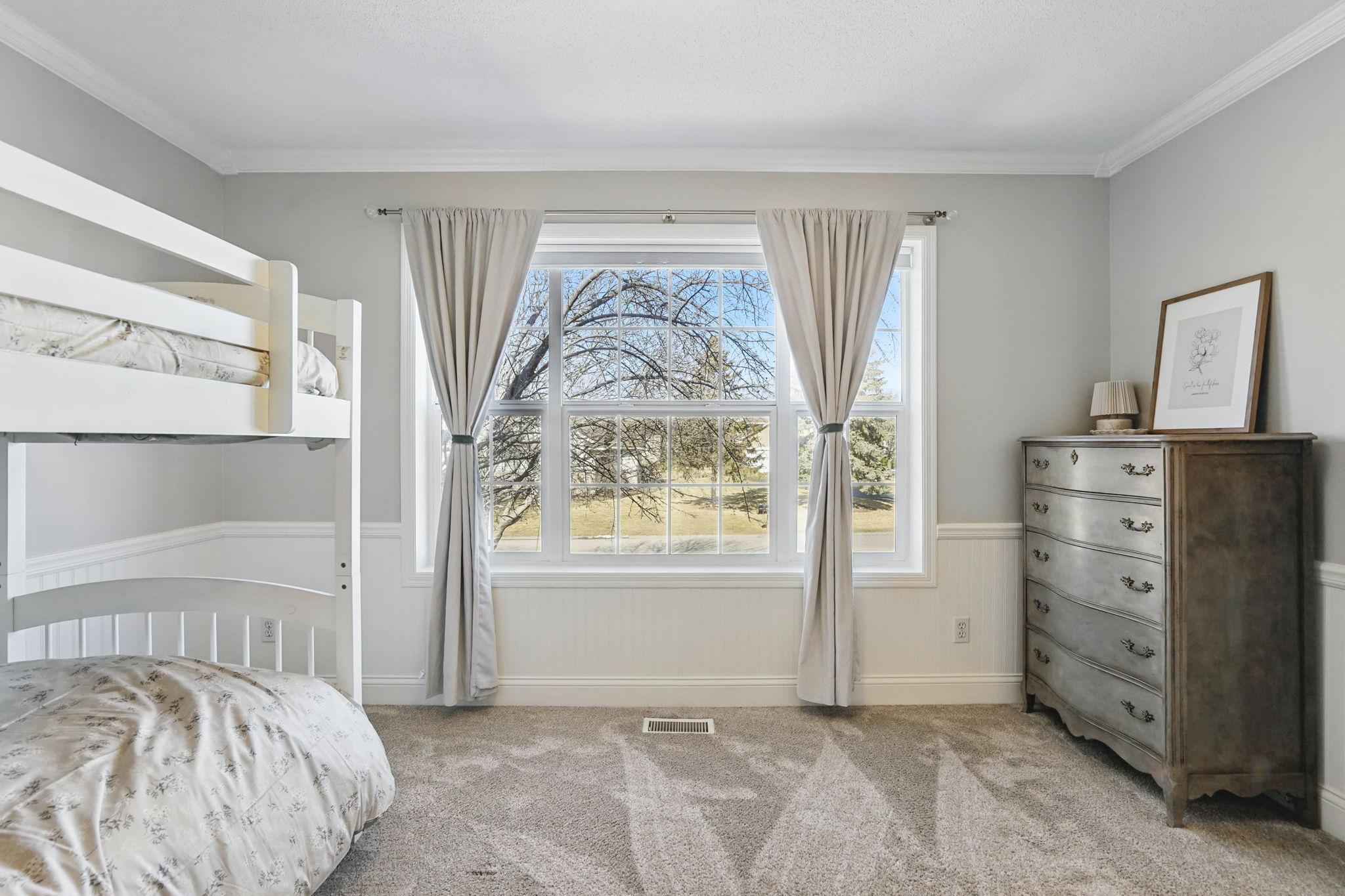 Third upper level bedroom with beautiful windows