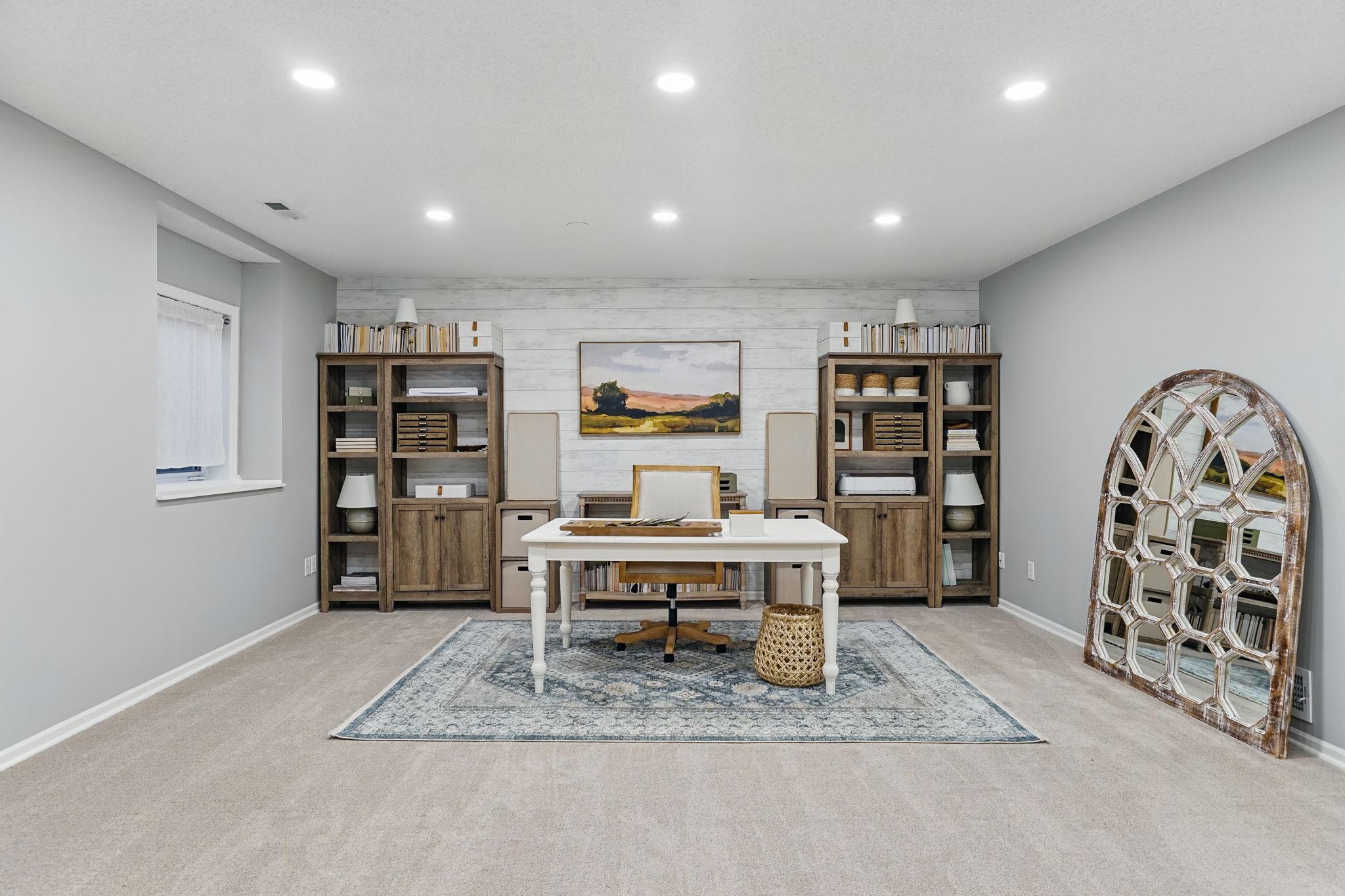 Open basement area currently used as a home office