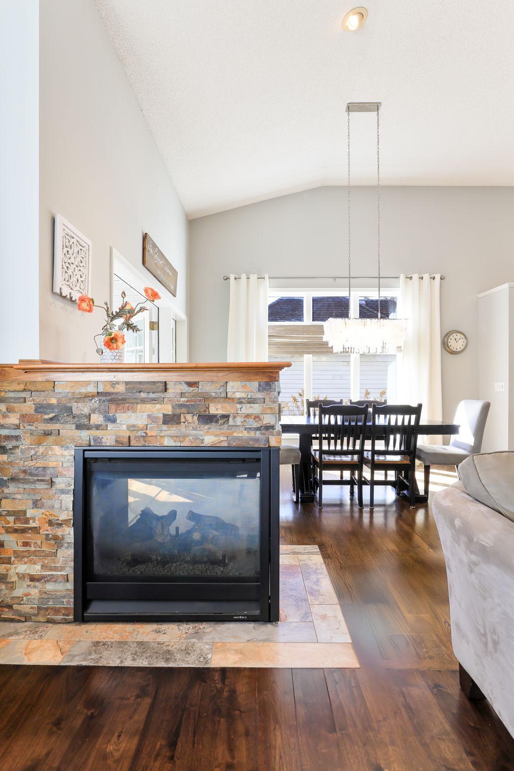 Statement fireplace and extra high ceilings.