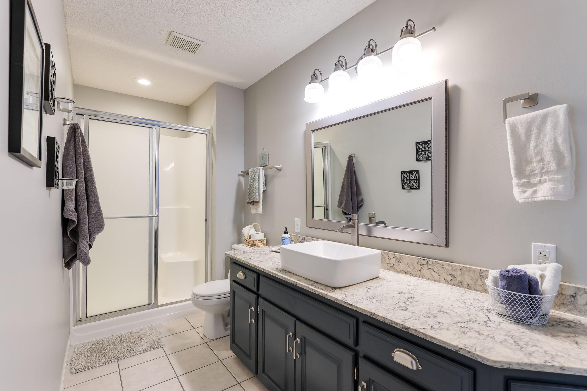 Main level full bath accessible through either the bedroom or foyer