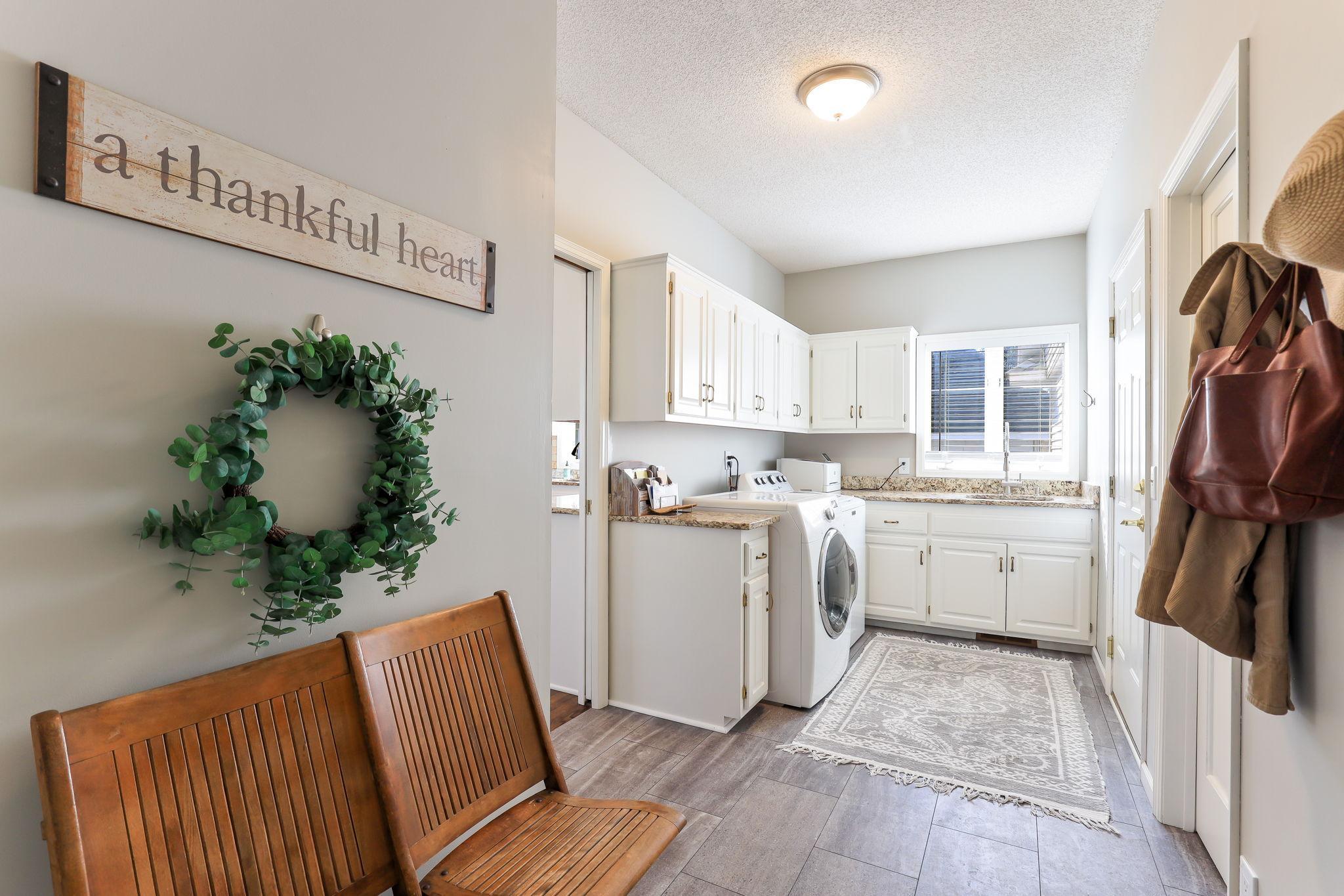 The laundry room is located between the garage and the foyer allowing for convenient main level living.