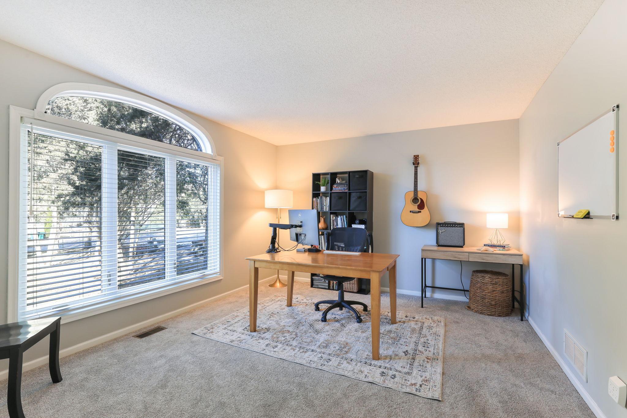 This main level bedroom two is currently used as an at-home office.