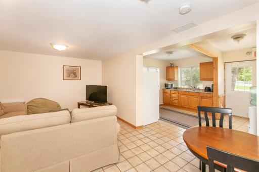 Workers' Lounge: access to outside and stall aisle; 3/4 bathroom, laundry area, full kitchen, living area heated and AC; separate room could be office