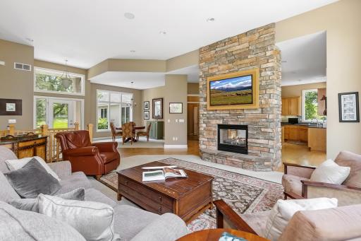 Open floor plan: 12' ceilings, 2 sided fireplace, hardwood floors and carpeted rooms