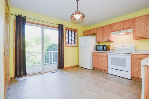 Kitchen-dining combo walks out to back balcony