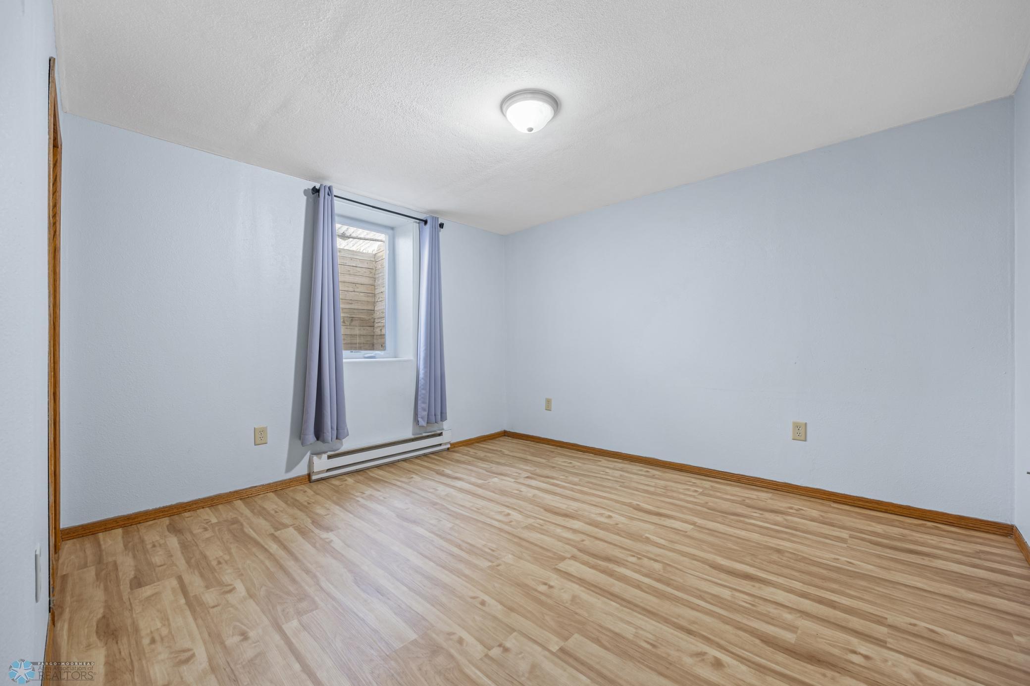 Bdrm 3 in basement w/new flooring