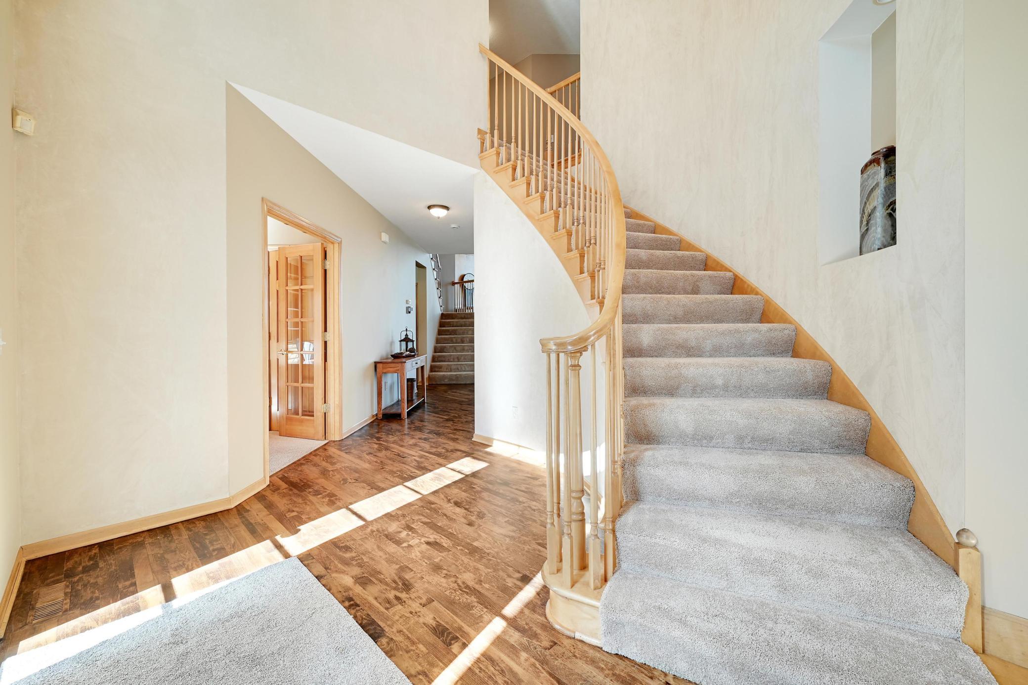 Grand Staircase greets you as you enter, double french doors on the left to the office