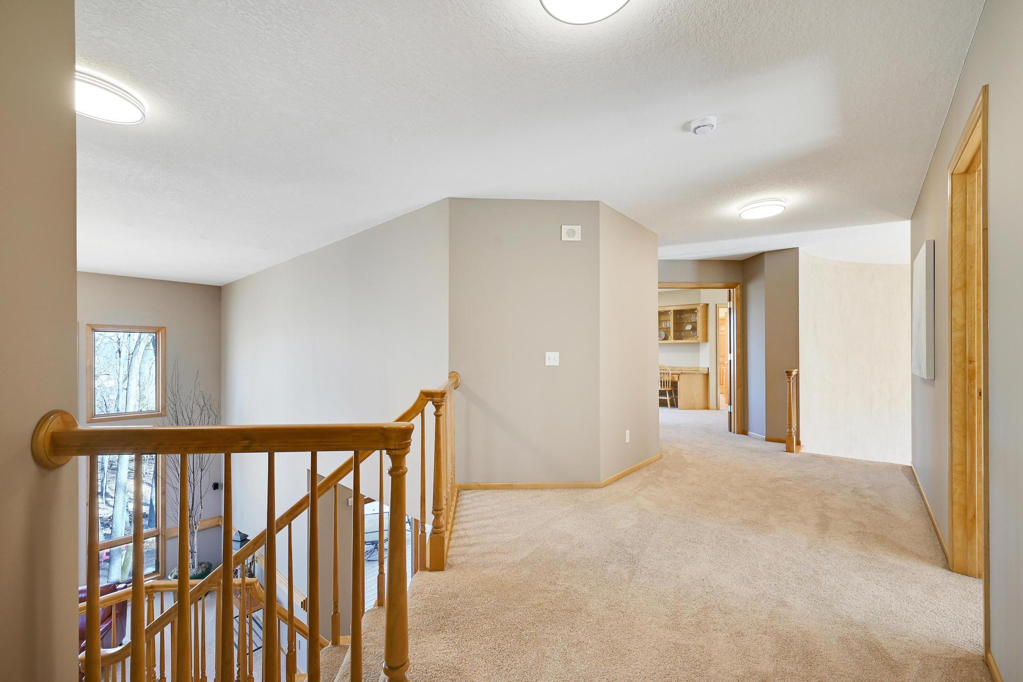 Dual staircases. Double doors to primary suite.