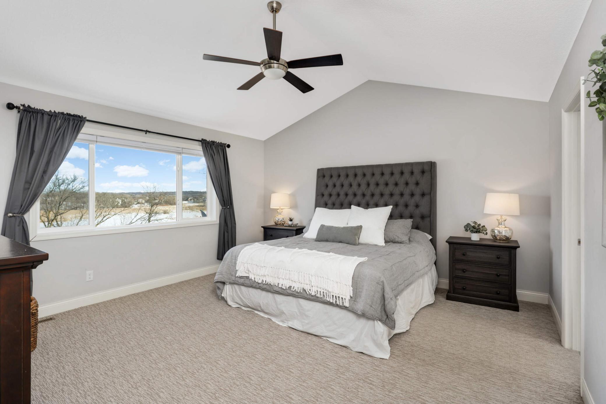 Primary suite with picturesque views of the wetlands.