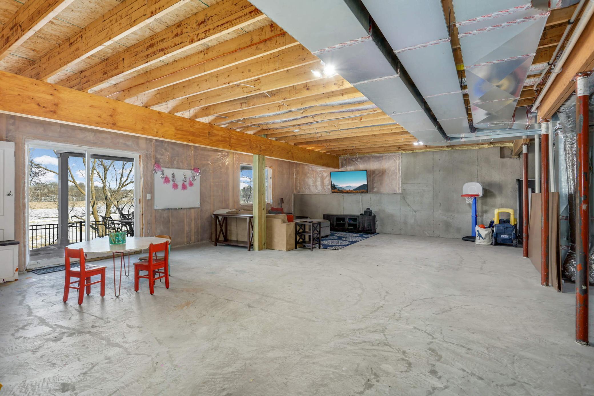 Expansive unfinished walk-out lower level.