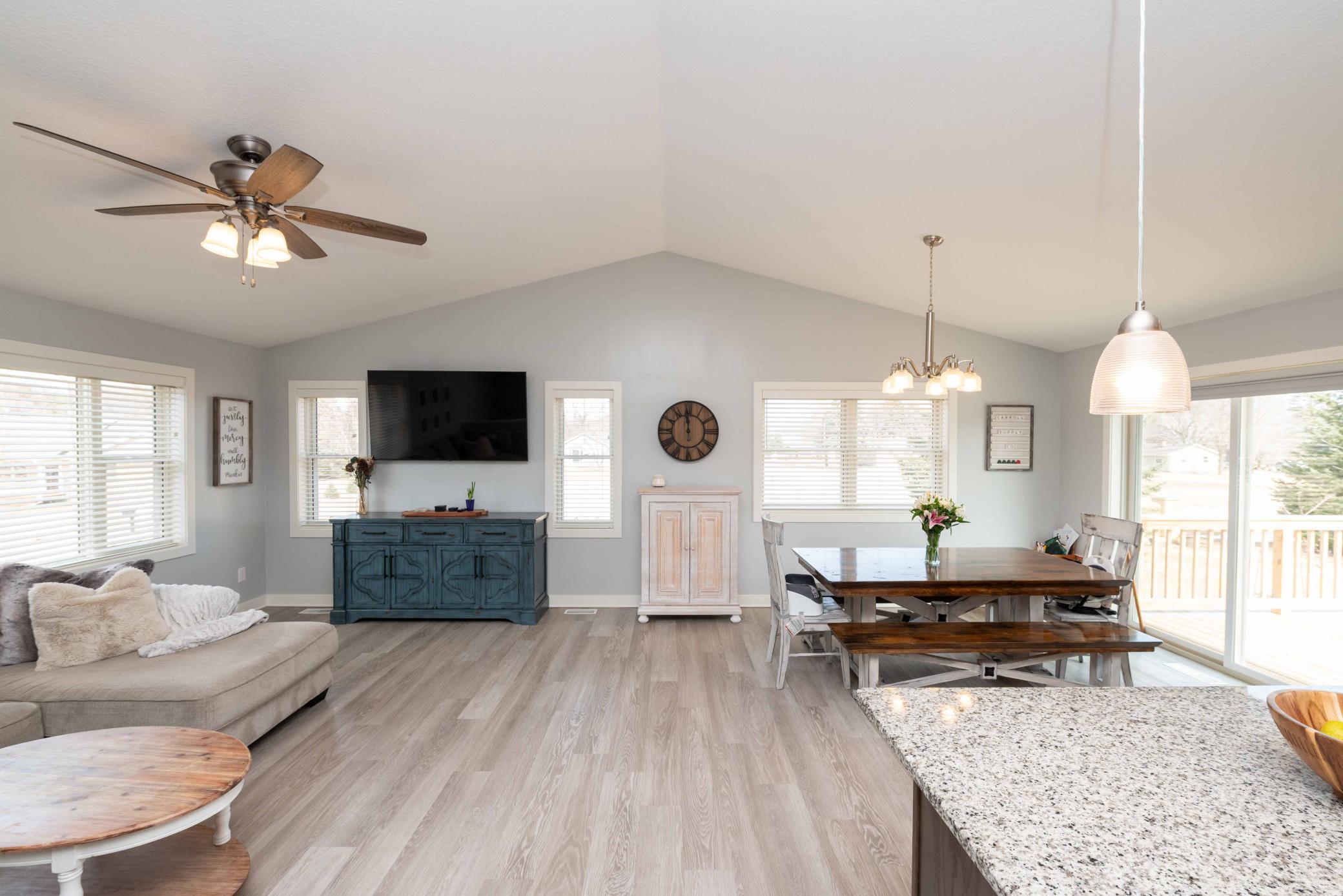 Vaulted Living room with so many windows brings in the natural light. It's where you'll want to hang out with friends or family!