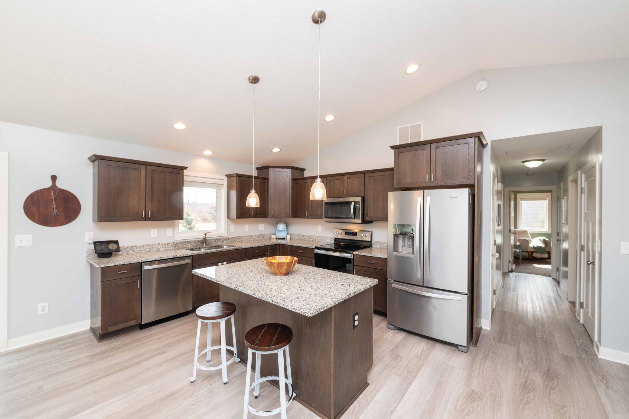 Granite countertops and SS appliances enhance this very functional kitchen. Don't you love a window over the sink to watch the morning sun?