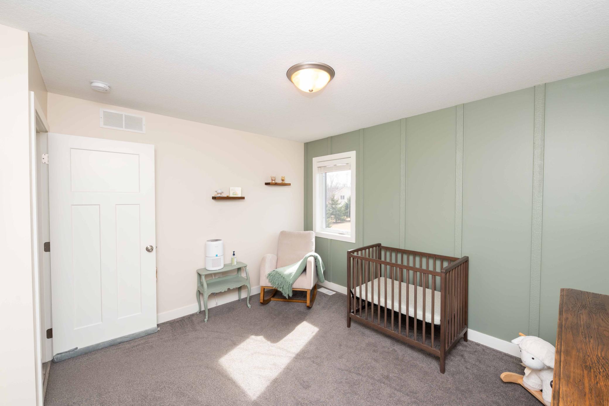 2nd bedroom right next to the primary bedroom. Southern exposure makes for a cheerful room! How about the wall treatment!