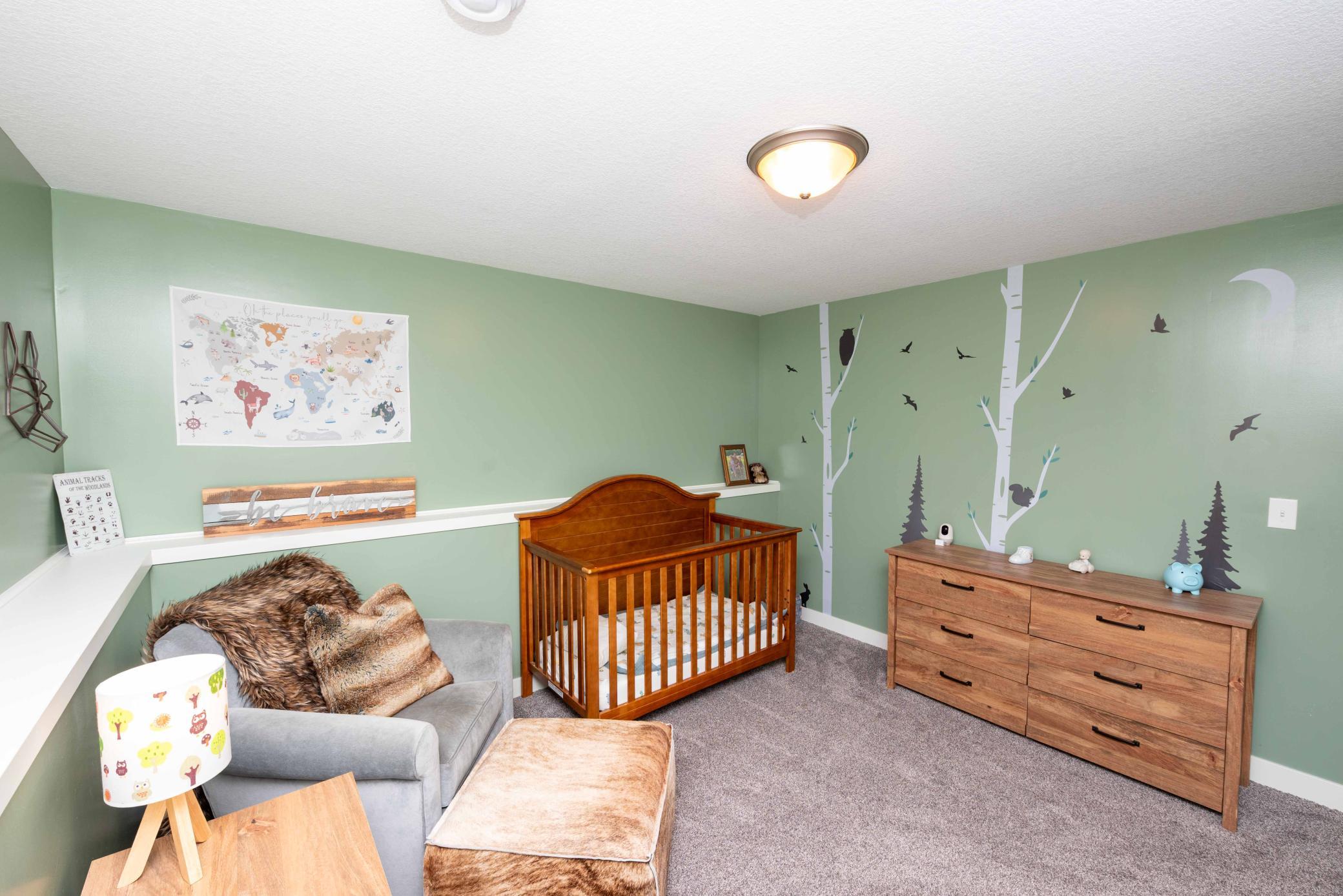 How adorable is this room? Birch trees and birds are easily removed without harm to walls. But leave on and it's one less project for you.