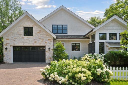 The corner lot is one of the largest in the village- Virtually impossible to rebuild this home with newly implemented Excelsior restrictions.