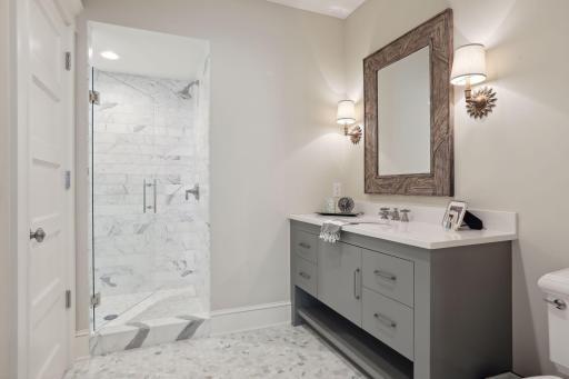 Beautiful 3/4 lower level bathroom with walk in marble shower