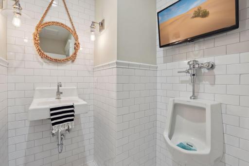 Separate 1/4 bath with urinal + TV (not to miss a second of the game!)