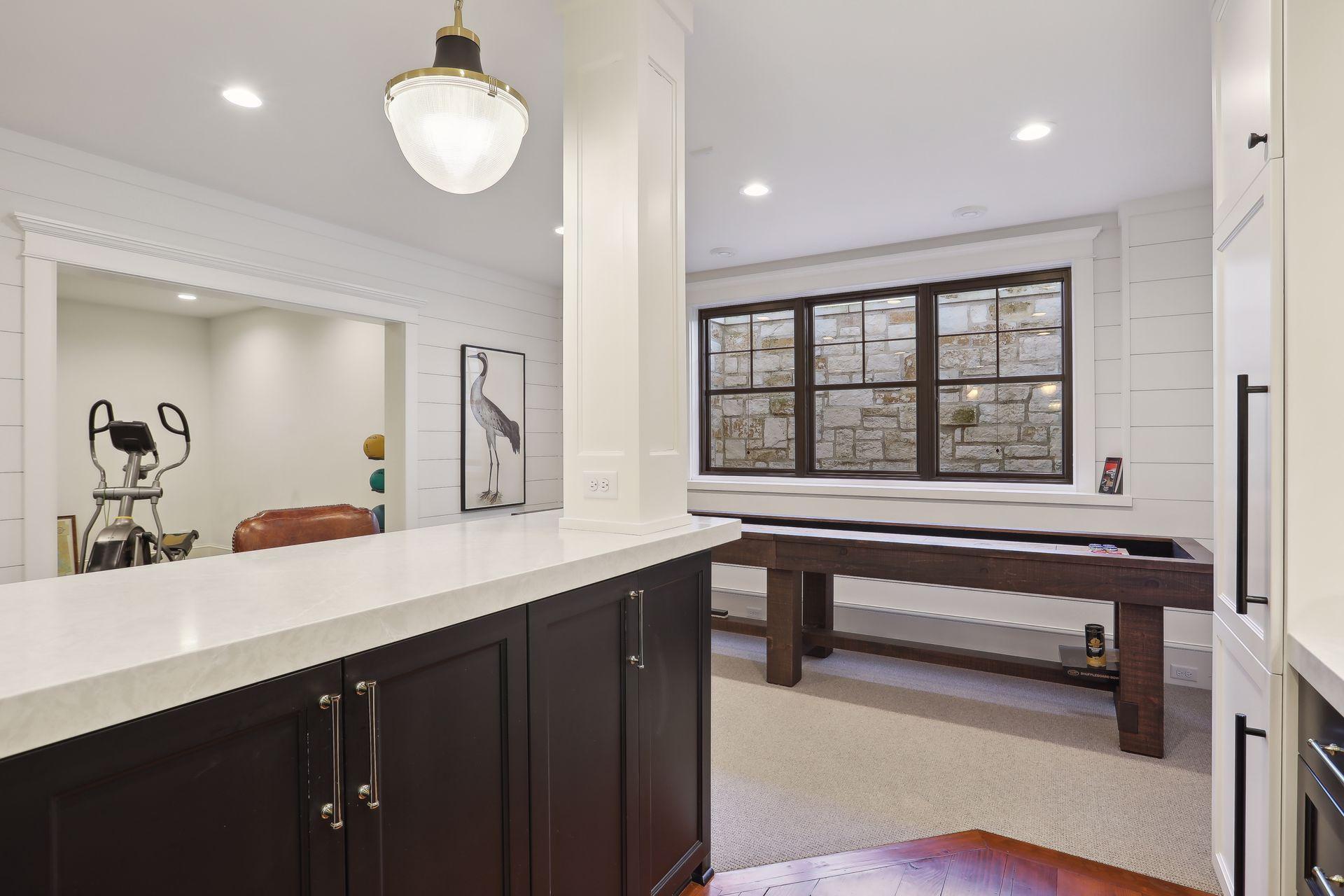 Not only an abundance of cabinetry, but even more space for a game table!