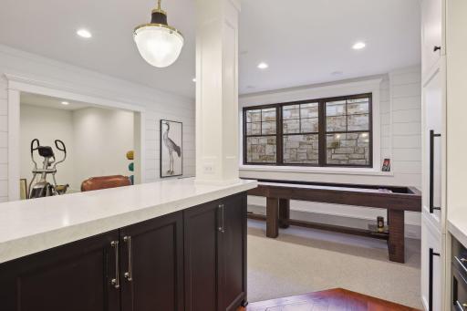 Not only an abundance of cabinetry, but even more space for a game table!