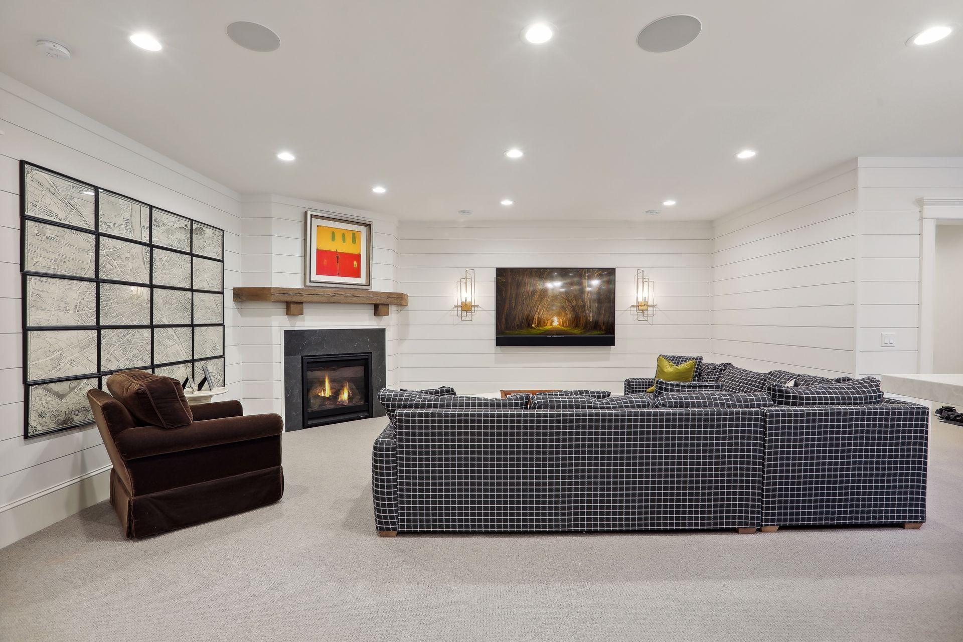 Beautifully appointed gas fireplace with custom beam mantle and elegant sconces. Not shown is the built in humidor for cigar enthusiasts!