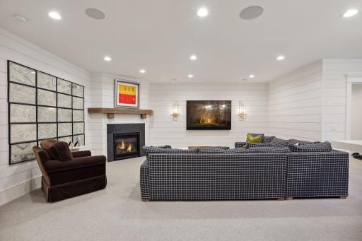 Beautifully appointed gas fireplace with custom beam mantle and elegant sconces. Not shown is the built in humidor for cigar enthusiasts!