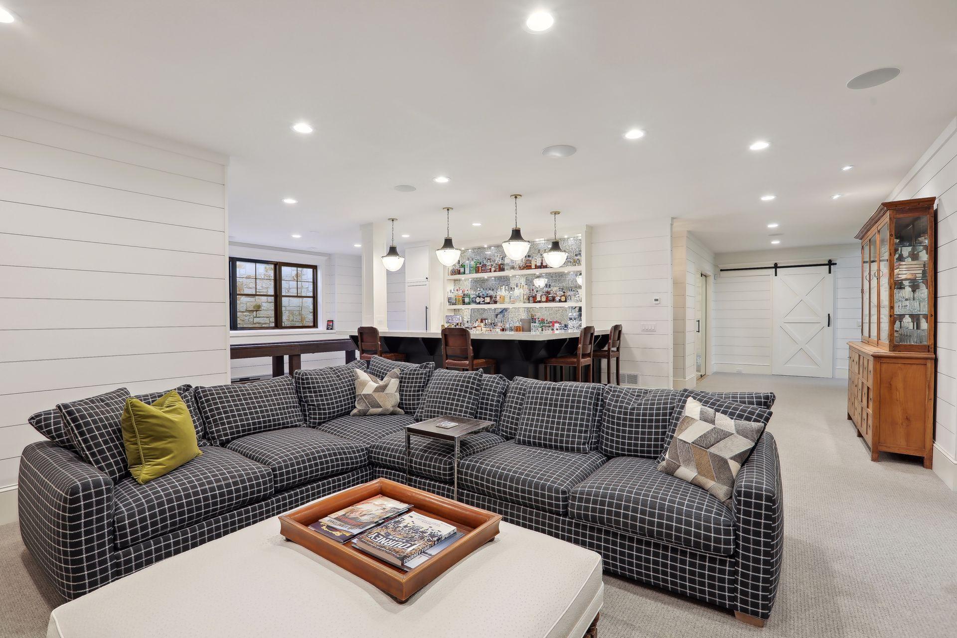 Ample seating to congregate with family and friends- this space is SO much larger than it photographs!