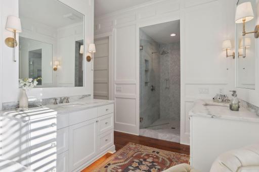 Walk in Carrara marble shower, separate stool room and double vanities maximize the space.
