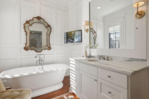 Large soaking tub with heated floors complete your bathing experience.