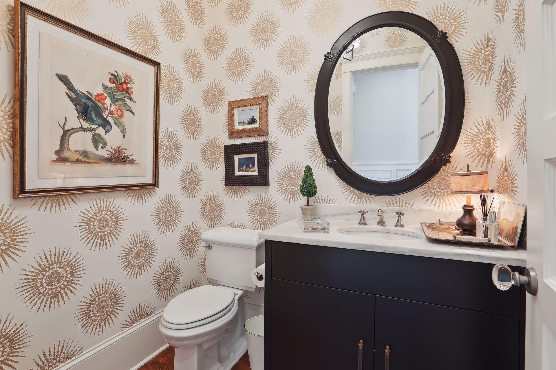 Elegant main level powder room with marble top, undermount sink and vanity.