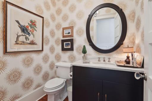 Elegant main level powder room with marble top, undermount sink and vanity.