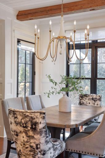 Informal, formal dining with a beautiful custom painted chandelier. Sun-lit from every direction.