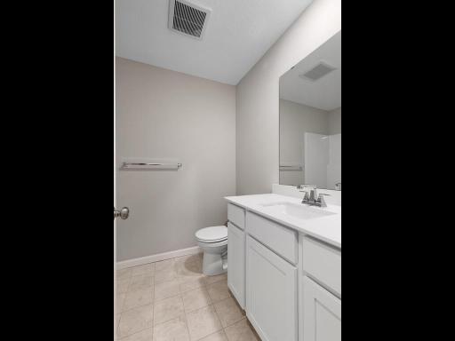 Hall Bathroom. Photo is taken of another home with similar plan and finishes.