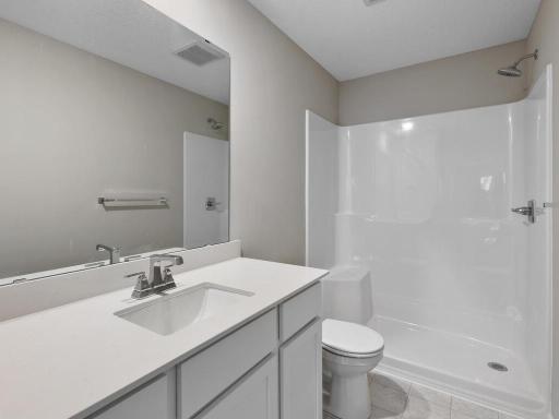 Private Primary Bathroom. Photo is taken of another home with similar plan and finishes.