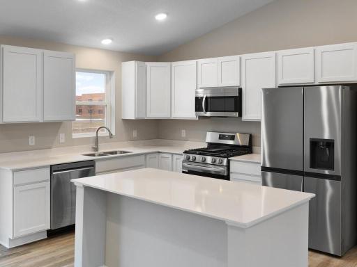 Photo is taken of another home with similar plan and finishes.