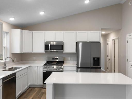 Kitchen. Photo is taken of another home with similar plan and finishes.