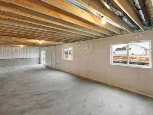 Unfinished Walkout Lower Level. Photo is taken of another home with similar plan and finishes.