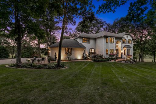 The home is set on a private, maturely wooded, acreage lot, on a quiet, charming cul-de-sac.