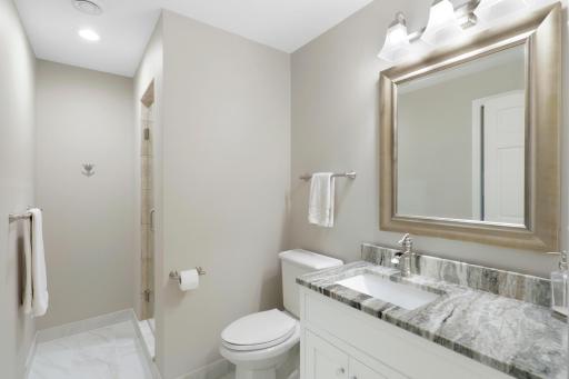 The lower level, a west facing walk-out elevation with look out windows, features a guest suite with a newly remodeled walk-thru bathroom, a large family room, a large game room and abundant dedicated storage.