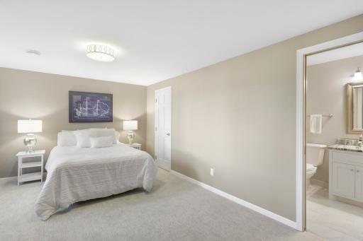 The lower level, a west facing walk-out elevation with look out windows, features a guest suite with a newly remodeled walk-thru bathroom, a large family room, a large game room and abundant dedicated storage.