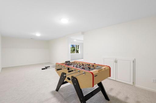 The lower level, a west facing walk-out elevation with look out windows, features a guest suite with a newly remodeled walk-thru bathroom, a large family room, a large game room and abundant dedicated storage.