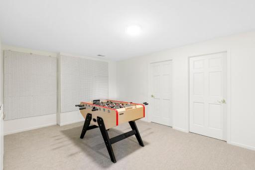 The lower level, a west facing walk-out elevation with look out windows, features a guest suite with a newly remodeled walk-thru bathroom, a large family room, a large game room and abundant dedicated storage.