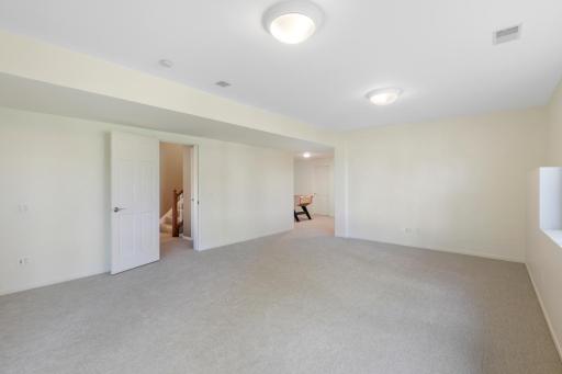 The lower level, a west facing walk-out elevation with look out windows, features a guest suite with a newly remodeled walk-thru bathroom, a large family room, a large game room and abundant dedicated storage.