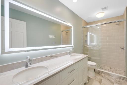 The upper level full bathroom has been beautifully updated.