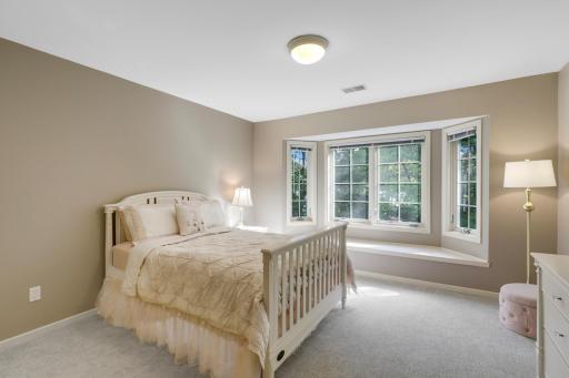 The second of four upper level bedrooms.