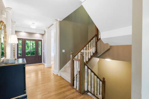 The upper level offers four spacious bedrooms, a large laundry room, and a wide catwalk that interacts with the main floor.