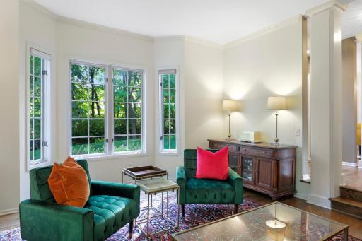 The main level family room is flooded with natural light and offers beautiful views of the front yard.