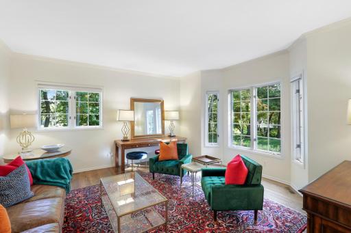 The main level family room is flooded with natural light and offers beautiful views of the front yard.