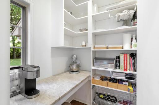 The newly remodeled, stunning, open concept, chefâs kitchen features Thermador and Viking appliances, in-cabinet lighting, a massive pantry with prep space and natural light, and a large center island with stool seating that opens to the dining room.