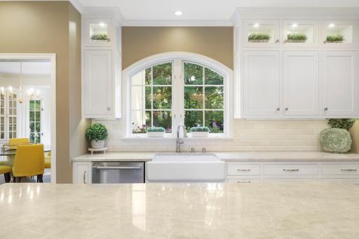 The newly remodeled, stunning, open concept, chefâs kitchen features Thermador and Viking appliances, in-cabinet lighting, a massive pantry with prep space and natural light, and a large center island with stool seating that opens to the dining room.