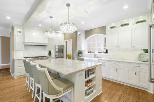 The newly remodeled, stunning, open concept, chefâs kitchen features Thermador and Viking appliances, in-cabinet lighting, a massive pantry with prep space and natural light, and a large center island with stool seating that opens to the dining room.